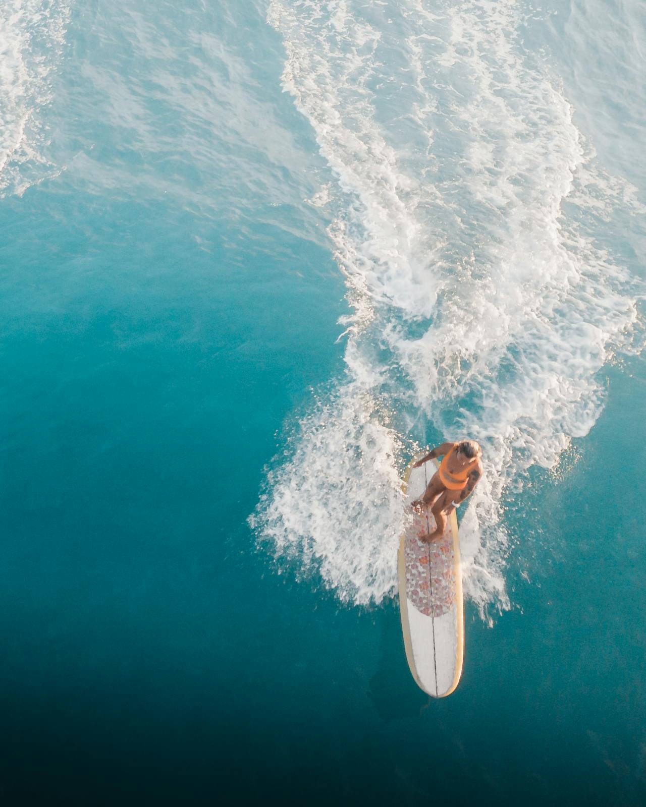 Paddle boarder moving across open water
